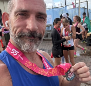 Christian from The Body Project finishing the City2Surf in 1:16:21 despite rainy conditions