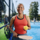 Active Pickleball player on court representing racquet sports performance, injury prevention, and healthy movement through osteopathy.
